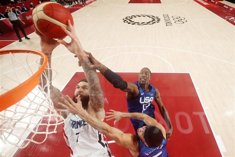 SAITAMA, JAPAN - JULY 25: Vincent Poirier #17 of Team France pulls down a rebound over Bam Adebayo #13 of Team United States during the first half of the Men's Preliminary Round Group B game on day two of the Tokyo 2020 Olympic Games at Saitama Super Arena on July 25, 2021 in Saitama, Japan. (Getty Images)