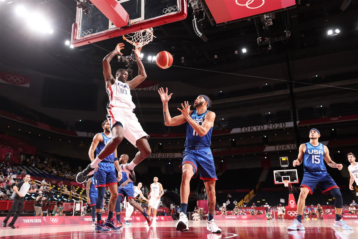 SAITAMA, JAPAN - JULY 25: Moustapha Fall #93 of Team France dunks the ball over JaVale McGee #11 of Team United States during the second half of the Men's Preliminary Round Group B game on day two of the Tokyo 2020 Olympic Games at Saitama Super Arena on July 25, 2021 in Saitama, Japan. (Getty Images)