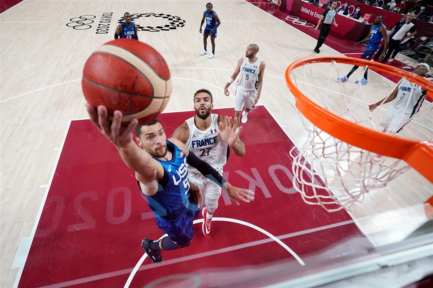 SAITAMA, JAPAN - JULY 25: Zachary Lavine #5 of Team United States drives past Rudy Gobert #27 of Team France for a layup during the second half of the Men's Preliminary Round Group B game on day two of the Tokyo 2020 Olympic Games at Saitama Super Arena on July 25, 2021 in Saitama, Japan. (Getty Images)
