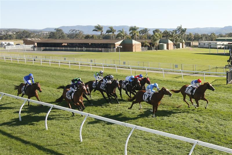 KEMBLA GRANGE, AUSTRALIA - SEPTEMBER 11: Brock Ryan (red cap) on Chat wins race 7 The Chandon Theo Marks Stakes during Sydney Racing at Kembla Grange Racecourse on September 11, 2021 in Kembla Grange, Australia. (Photo by Mark Evans/Getty Images)