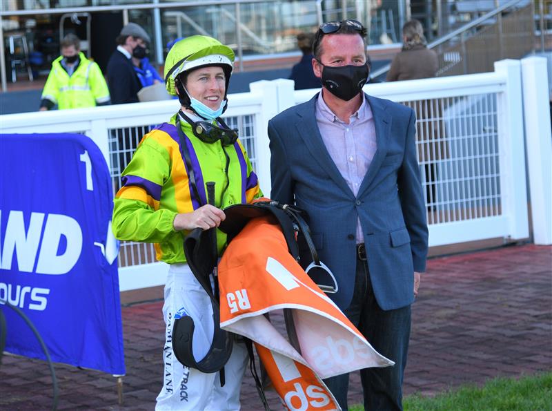 MELBOURNE, AUSTRALIA - SEPTEMBER 18: Damian Lane poses with Trainer Matthew Ellerton after riding General Beau to win race 5,  the Pinchapoo Plate, during Melbourne Racing at Caulfield Racecourse on September 18, 2021 in Melbourne, Australia. (Photo by Vince Caligiuri/Getty Images)