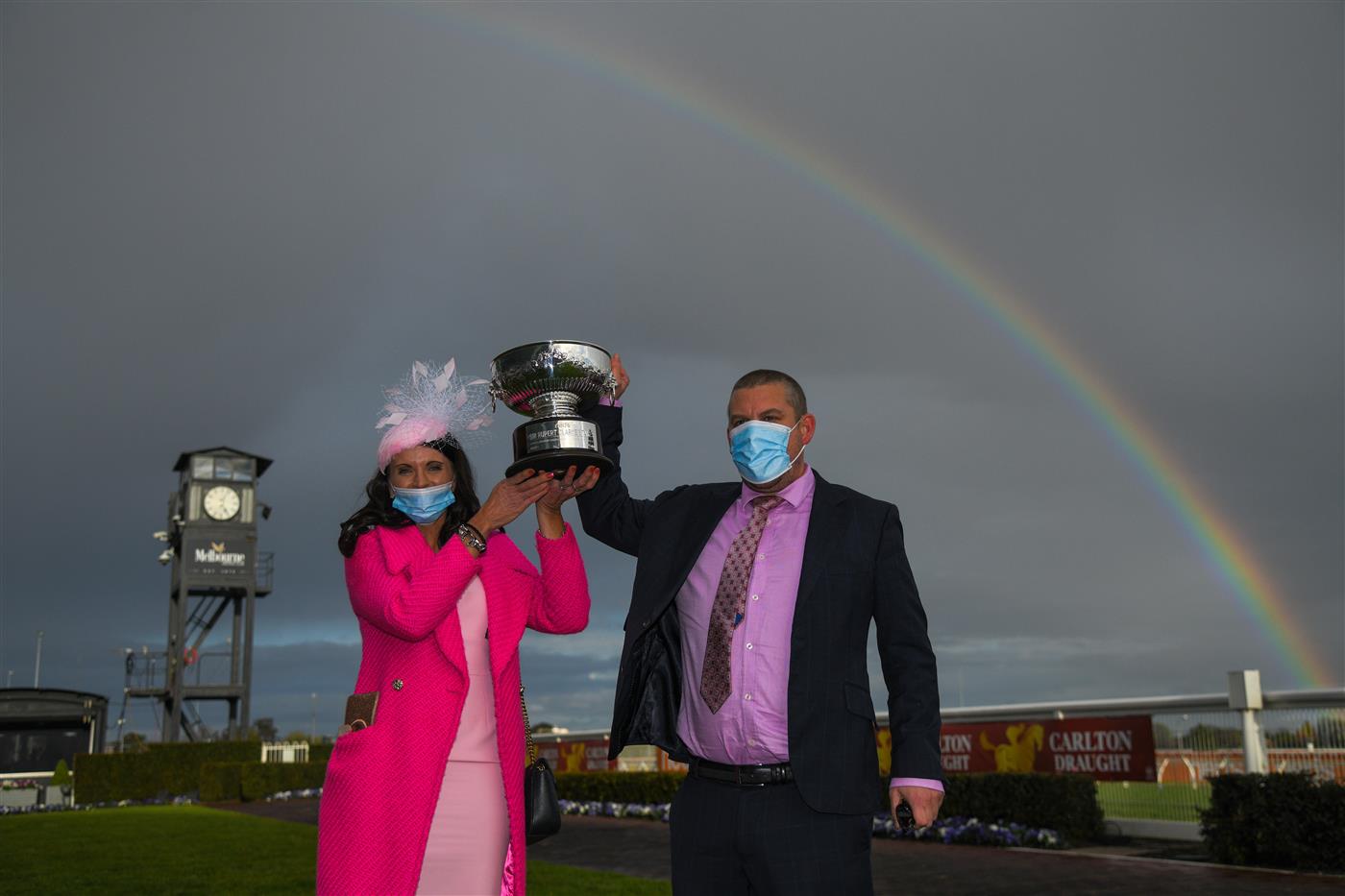 MELBOURNE, AUSTRALIA - SEPTEMBER 18: Trainers Natalie Young and Trent Busuttin pose with the trophy after Sierra Sue won Race 8, the Neds Sir Rupert Clarke Stakes, during Melbourne Racing at Caulfield Racecourse on September 18, 2021 in Melbourne, Australia. (Photo by Vince Caligiuri/Getty Images)