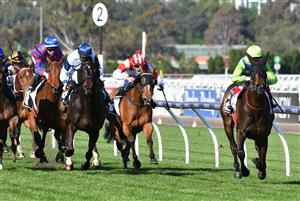 MELBOURNE, AUSTRALIA - SEPTEMBER 22: Craig Williams riding Barb Raider winning race 5, the Kennedy Oaks Preview, during Melbourne Racing at Flemington Racecourse on September 22, 2021 in Melbourne, Australia. (Photo by Vince Caligiuri/Getty Images)