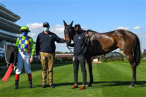 MELBOURNE, AUSTRALIA - SEPTEMBER 22: Trainer Jerome Hunter poses with Craig Williams after Barb Raider won race 5, the Kennedy Oaks Preview, during Melbourne Racing at Flemington Racecourse on September 22, 2021 in Melbourne, Australia. (Photo by Vince Caligiuri/Getty Images)