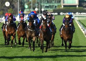 MELBOURNE, AUSTRALIA - SEPTEMBER 22: Craig Williams riding Mr Brightside winning Race 7, the Hanan Displays Mile, during Melbourne Racing at Flemington Racecourse on September 22, 2021 in Melbourne, Australia. (Photo by Vince Caligiuri/Getty Images)