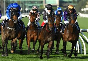MELBOURNE, AUSTRALIA - SEPTEMBER 22: Craig Williams riding Mr Brightside winning Race 7, the Hanan Displays Mile, during Melbourne Racing at Flemington Racecourse on September 22, 2021 in Melbourne, Australia. (Photo by Vince Caligiuri/Getty Images)
