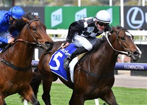 MELBOURNE, AUSTRALIA - SEPTEMBER 22: Patrick Moloney riding Cavalla defeats Damien Oliver riding Contemporary to win Race 2, the Darley Spring Preview, during Melbourne Racing at Flemington Racecourse on September 22, 2021 in Melbourne, Australia. (Photo by Vince Caligiuri/Getty Images)