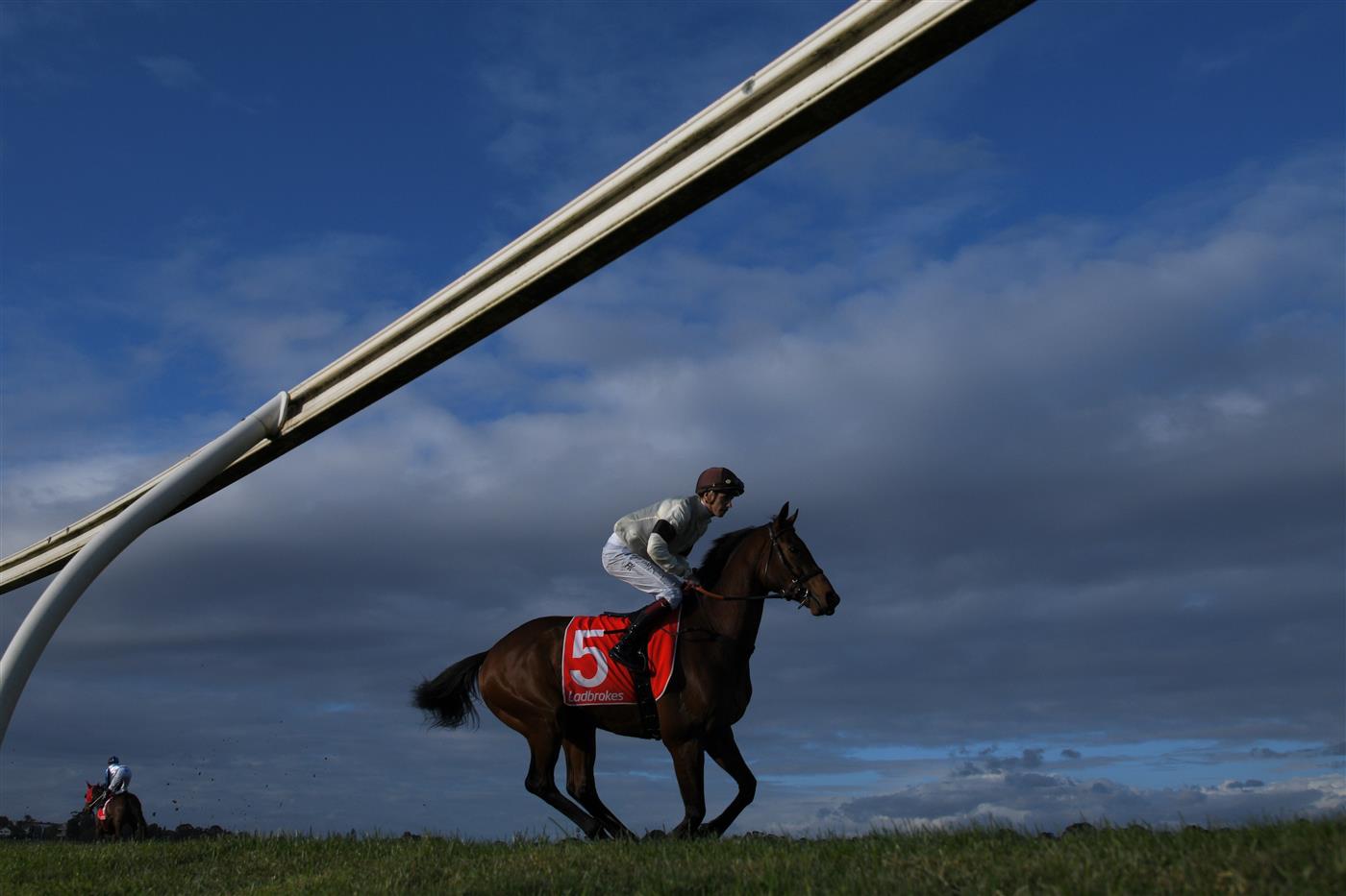 MELBOURNE, AUSTRALIA - SEPTEMBER 25: Fred Kersley riding Khoekhoe to the start of Race 9, the Evergreen Turf Handicap, during Melbourne Racing at Sandown Racecourse on September 25, 2021 in Melbourne, Australia. (Photo by Vince Caligiuri/Getty Images)