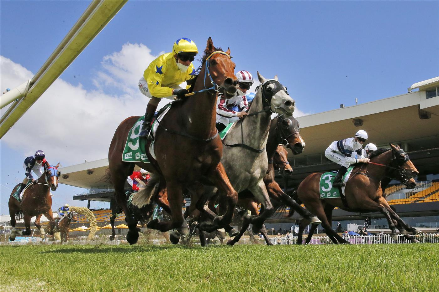 SYDNEY, AUSTRALIA - SEPTEMBER 25: Kerrin McEvoy on The Fossil (yellow), wins race 2 the TAB highway Class 2 Handicap during Sydney Racing on Golden Rose Day at Rosehill Gardens on September 25, 2021 in Sydney, Australia. (Photo by Mark Evans/Getty Images)