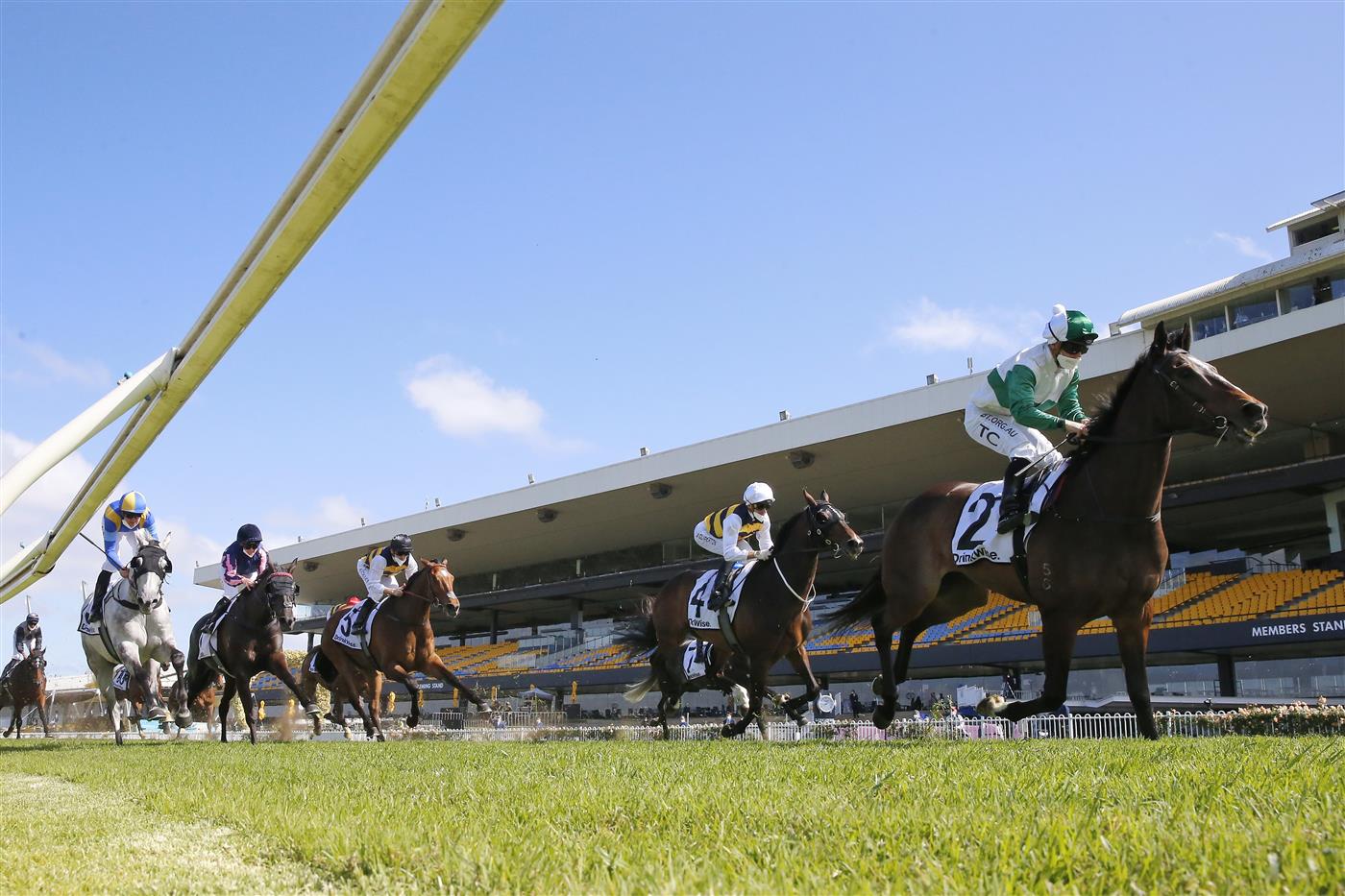 SYDNEY, AUSTRALIA - SEPTEMBER 25: Tim Clark  on Entente (green) wins race 4 the Drinkwise Colin Stephen Quality during Sydney Racing on Golden Rose Day at Rosehill Gardens on September 25, 2021 in Sydney, Australia. (Photo by Mark Evans/Getty Images)