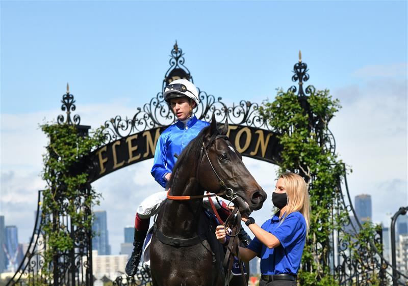 MELBOURNE, AUSTRALIA - OCTOBER 02: Fred Kersley riding Kallos after winning race 5,  the Vrc Members Danehill Stakes, during Melbourne Racing at Flemington Racecourse on October 02, 2021 in Melbourne, Australia. (Photo by Vince Caligiuri/Getty Images)