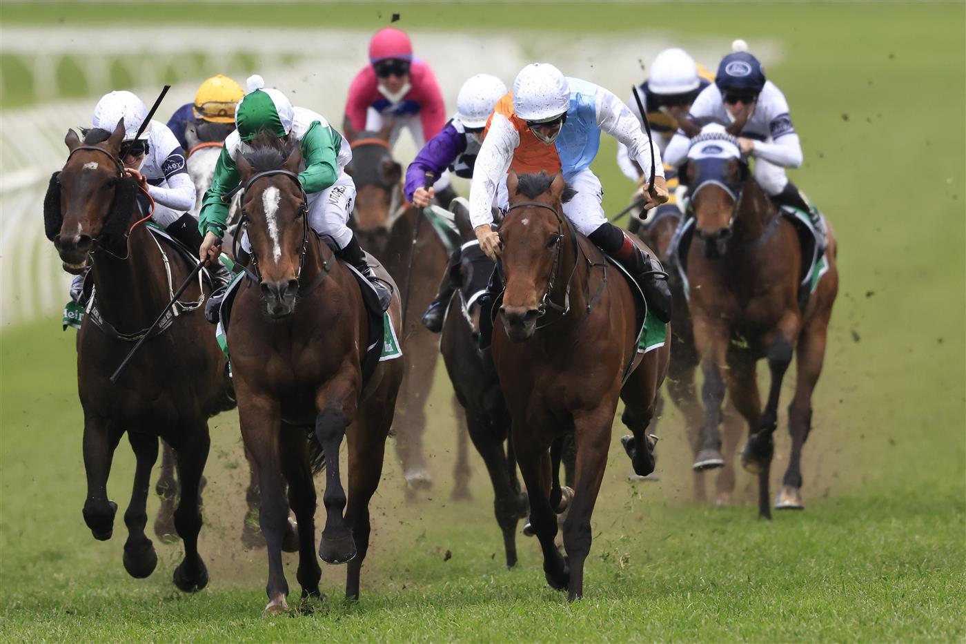 SYDNEY, AUSTRALIA - OCTOBER 02: Hugh Bowman on Montefilia (orange/blue), wins race 9 the Heineken Metropolitan during Sydney Racing on Epsom Day at Royal Randwick Racecourse on October 02, 2021 in Sydney, Australia. (Photo by Mark Evans/Getty Images)