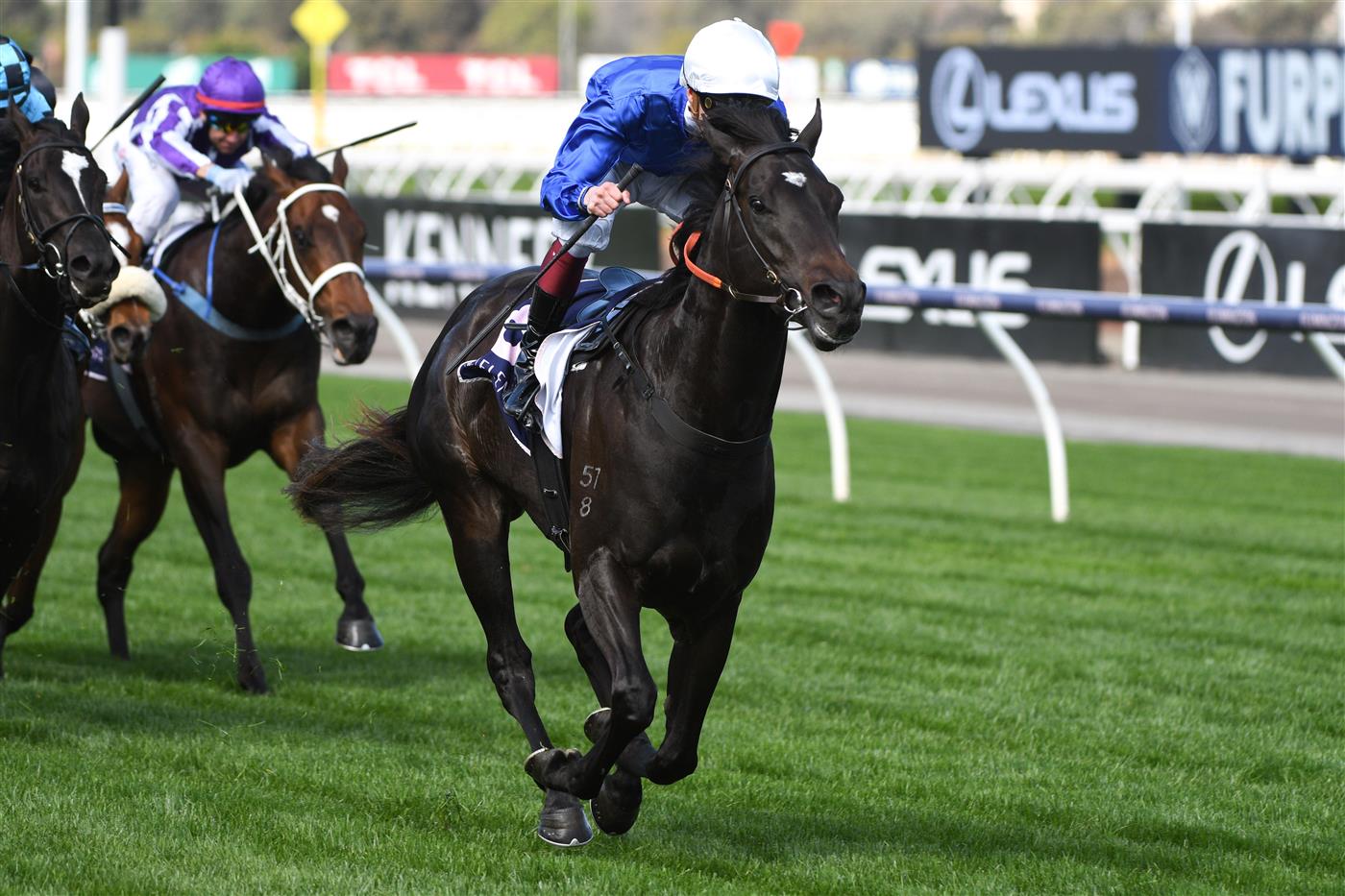 MELBOURNE, AUSTRALIA - OCTOBER 02: Fred Kersley riding Kallos winning  race 5,  the Vrc Members Danehill Stakes, during Melbourne Racing at Flemington Racecourse on October 02, 2021 in Melbourne, Australia. (Photo by Vince Caligiuri/Getty Images)