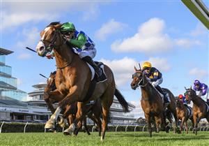 MELBOURNE, AUSTRALIA - OCTOBER 02: John Allen riding Grand Promenade winning  Race 8, the Lexus Bart Cummings,  during Melbourne Racing at Flemington Racecourse on October 02, 2021 in Melbourne, Australia. (Photo by Vince Caligiuri/Getty Images)
