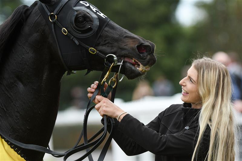 MELBOURNE, AUSTRALIA - APRIL 17: Strapper Christin Schotten with So Si Bon after winning Race 4, the Irt Vobis Gold Mile, during Melbourne Racing at Caulfield Racecourse on April 17, 2021 in Melbourne, Australia. (Photo by Vince Caligiuri/Getty Images)