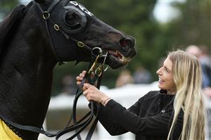 MELBOURNE, AUSTRALIA - APRIL 17: Strapper Christin Schotten with So Si Bon after winning Race 4, the Irt Vobis Gold Mile, during Melbourne Racing at Caulfield Racecourse on April 17, 2021 in Melbourne, Australia. (Photo by Vince Caligiuri/Getty Images)