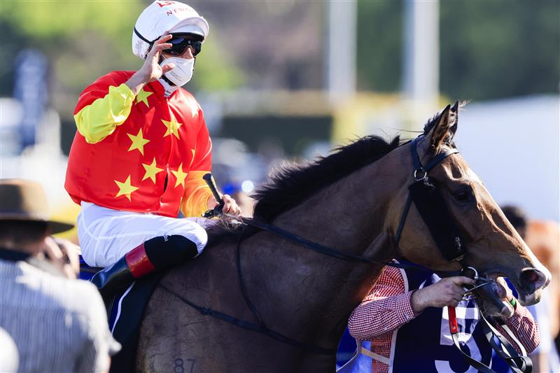 SYDNEY, AUSTRALIA - OCTOBER 09: Hugh Bowman aboard Aim waves after winning race 7 the Silver Eagle during Sydney Racing at Royal Randwick Racecourse on October 09, 2021 in Sydney, Australia. (Photo by Mark Evans/Getty Images)