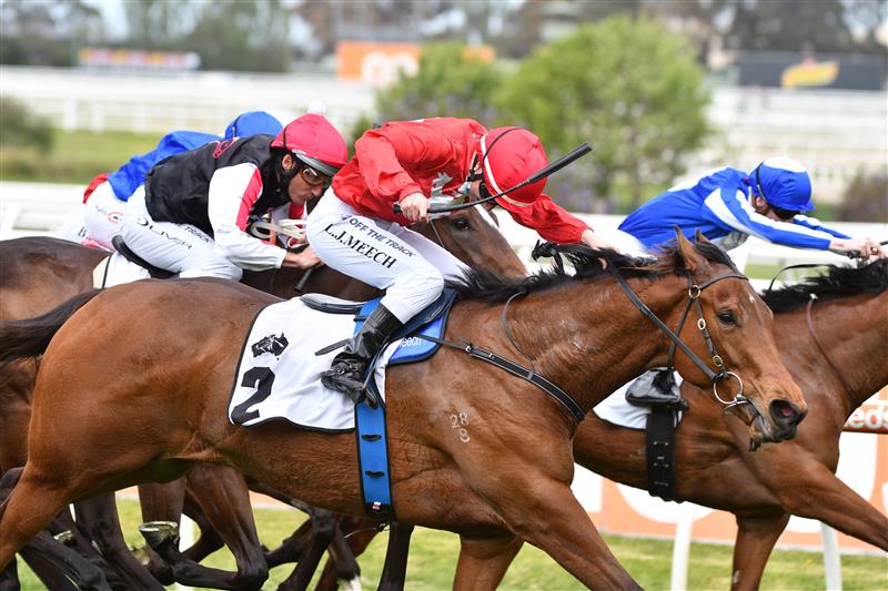 MELBOURNE, AUSTRALIA - OCTOBER 09: Linda Meech riding Sneaky Five winning Race 4, the Thoroughbred Club Stakes,  during Melbourne Racing at Caulfield Racecourse on October 09, 2021 in Melbourne, Australia. (Photo by Vince Caligiuri/Getty Images)
