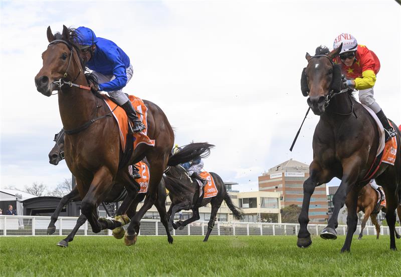 MELBOURNE, AUSTRALIA - OCTOBER 09: Damien Oliver riding Anamoe defeats Luke Currie riding Captivant in  Race 8, the Neds Caulfield Guineas, winning during Melbourne Racing at Caulfield Racecourse on October 09, 2021 in Melbourne, Australia. (Photo by Vince Caligiuri/Getty Images)