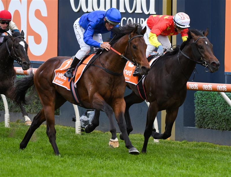 MELBOURNE, AUSTRALIA - OCTOBER 09: Damien Oliver riding Anamoe defeats Luke Currie riding Captivant in  Race 8, the Neds Caulfield Guineas, winning during Melbourne Racing at Caulfield Racecourse on October 09, 2021 in Melbourne, Australia. (Photo by Vince Caligiuri/Getty Images)