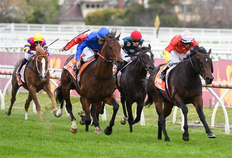 MELBOURNE, AUSTRALIA - OCTOBER 09: Damien Oliver riding Anamoe defeats Luke Currie riding Captivant in  Race 8, the Neds Caulfield Guineas, winning during Melbourne Racing at Caulfield Racecourse on October 09, 2021 in Melbourne, Australia. (Photo by Vince Caligiuri/Getty Images)