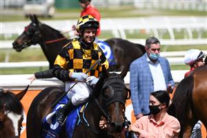 MELBOURNE, AUSTRALIA - OCTOBER 09: Brett Prebble riding Kahma Lass after winning Race 2, the The Big Screen Company Weekend Hussler, during Melbourne Racing at Caulfield Racecourse on October 09, 2021 in Melbourne, Australia. (Photo by Vince Caligiuri/Getty Images)