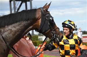 MELBOURNE, AUSTRALIA - OCTOBER 09: Brett Prebble riding Probabeel after winning race 6, the Neds Might And Power, during Melbourne Racing at Caulfield Racecourse on October 09, 2021 in Melbourne, Australia. (Photo by Vince Caligiuri/Getty Images)