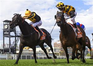 MELBOURNE, AUSTRALIA - OCTOBER 09: Brett Prebble riding Probabeel (r) defeats Jordan Childs riding Nonconformist in race 6, the Neds Might And Power, during Melbourne Racing at Caulfield Racecourse on October 09, 2021 in Melbourne, Australia. (Photo by Vince Caligiuri/Getty Images)