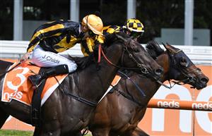MELBOURNE, AUSTRALIA - OCTOBER 09: Brett Prebble riding Probabeel defeats Jordan Childs riding Nonconformist in race 6, the Neds Might And Power, during Melbourne Racing at Caulfield Racecourse on October 09, 2021 in Melbourne, Australia. (Photo by Vince Caligiuri/Getty Images)