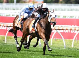 MELBOURNE, AUSTRALIA - OCTOBER 09: Jye McNeil riding Lombardo winning Race 3, the Neds Village Stakes, during Melbourne Racing at Caulfield Racecourse on October 09, 2021 in Melbourne, Australia. (Photo by Vince Caligiuri/Getty Images)