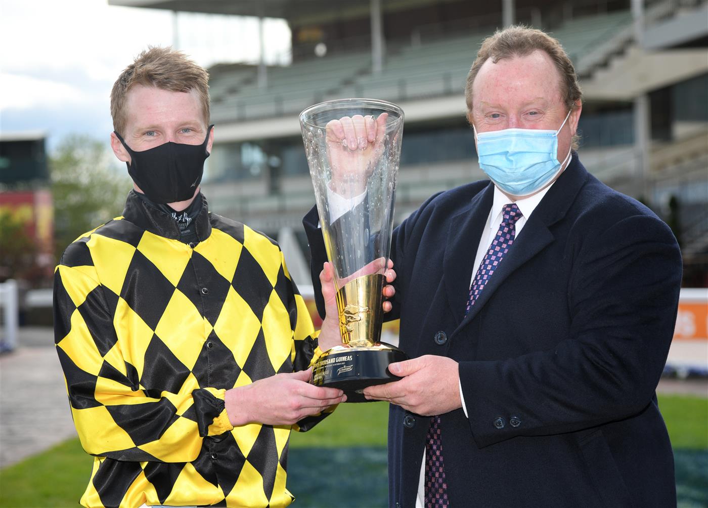 MELBOURNE, AUSTRALIA - OCTOBER 13: Damien Thornton and trainer Wayne Hawkes pose with the trophy after Yearning won Race 7, the Schweppes Thousand Guineas,  during Thousand Guineas Day at Caulfield Racecourse on October 13, 2021 in Melbourne, Australia. (Photo by Vince Caligiuri/Getty Images)