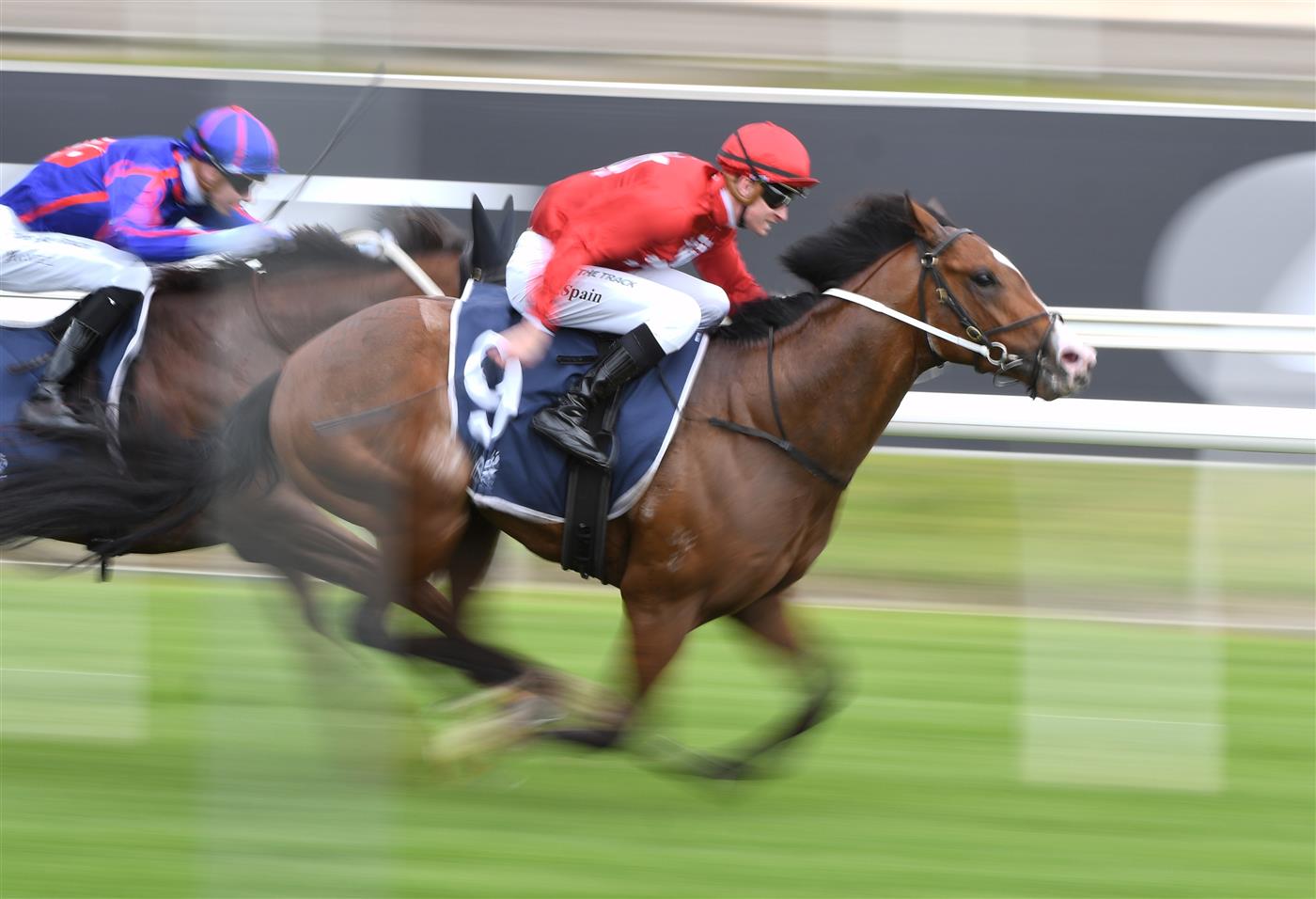 MELBOURNE, AUSTRALIA - OCTOBER 13: Zac Spain riding Extreme Warrior (red) defeats Jye McNeil riding Profiteer in race 6, the Catanach's Jewellers Blue Sapphire Stakes at Caulfield Racecourse on October 13, 2021. (Getty)