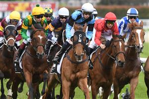 MELBOURNE, AUSTRALIA - OCTOBER 13: General view of riders  during Thousand Guineas Day at Caulfield Racecourse on October 13, 2021 in Melbourne, Australia. (Photo by Vince Caligiuri/Getty Images)