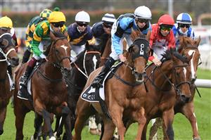 MELBOURNE, AUSTRALIA - OCTOBER 13: General view of riders  during Thousand Guineas Day at Caulfield Racecourse on October 13, 2021 in Melbourne, Australia. (Photo by Vince Caligiuri/Getty Images)