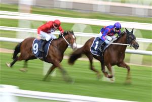 MELBOURNE, AUSTRALIA - OCTOBER 13: Zac Spain riding Extreme Warrior (red) defeats Jye McNeil riding Profiteer in race 6, the Catanach's Jewellers Blue Sapphire Stakes at Caulfield Racecourse on October 13, 2021. (Getty)