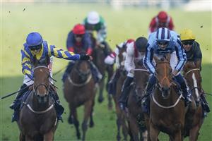 ASCOT, ENGLAND - OCTOBER 16: Hollie Doyle riding Trueshan (blue/yellow) win The Qipco British Champions Long Distance Cup during the Qipco British Champions Day at Ascot Racecourse on October 16, 2021 in Ascot, England. (Photo by Alan Crowhurst/Getty Images)