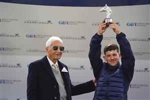 ASCOT, ENGLAND - OCTOBER 16: Jockey Marco Ghiani, winner of the Champion Apprentice title receives his trophy from Lester Piggott during the Qipco British Champions Day at Ascot Racecourse on October 16, 2021 in Ascot, England. (Photo by Alan Crowhurst/Getty Images)