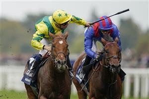 ASCOT, ENGLAND - OCTOBER 16: Mickael Barzalona riding Sealiway (yellow/green) win The Qipco Champion Stakes during the Qipco British Champions Day at Ascot Racecourse on October 16, 2021 in Ascot, England. (Photo by Alan Crowhurst/Getty Images)