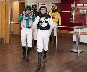 CHELTENHAM, ENGLAND - OCTOBER 22: Harry Skelton leads jockeys out of the weighing room at Cheltenham Racecourse on October 22, 2021 in Cheltenham, England. (Photo by Alan Crowhurst/Getty Images)