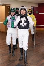 CHELTENHAM, ENGLAND - OCTOBER 22: Harry Skelton leads jockeys out of the weighing room at Cheltenham Racecourse on October 22, 2021 in Cheltenham, England. (Photo by Alan Crowhurst/Getty Images)