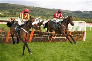 CHELTENHAM, ENGLAND - OCTOBER 22: Sam Twiston-Davies riding Guard Your Dreams (R, red) clear the last to win The Abu Dhabi Digital Exchange Handicap Hurdle at Cheltenham Racecourse on October 22, 2021 in Cheltenham, England. (Photo by Alan Crowhurst/Getty Images)