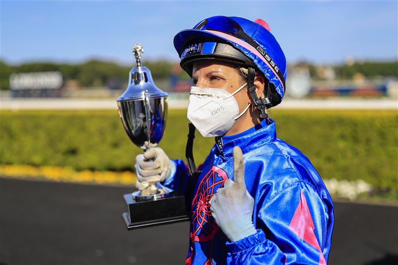 SYDNEY, AUSTRALIA - OCTOBER 23: Jenny Duggan holds up her trophy after winning race 7 the Clubsnsw City Tattersalls Club Cup on Torrens during Sydney Racing at Royal Randwick Racecourse on October 23, 2021 in Sydney, Australia. (Photo by Mark Evans/Getty Images)