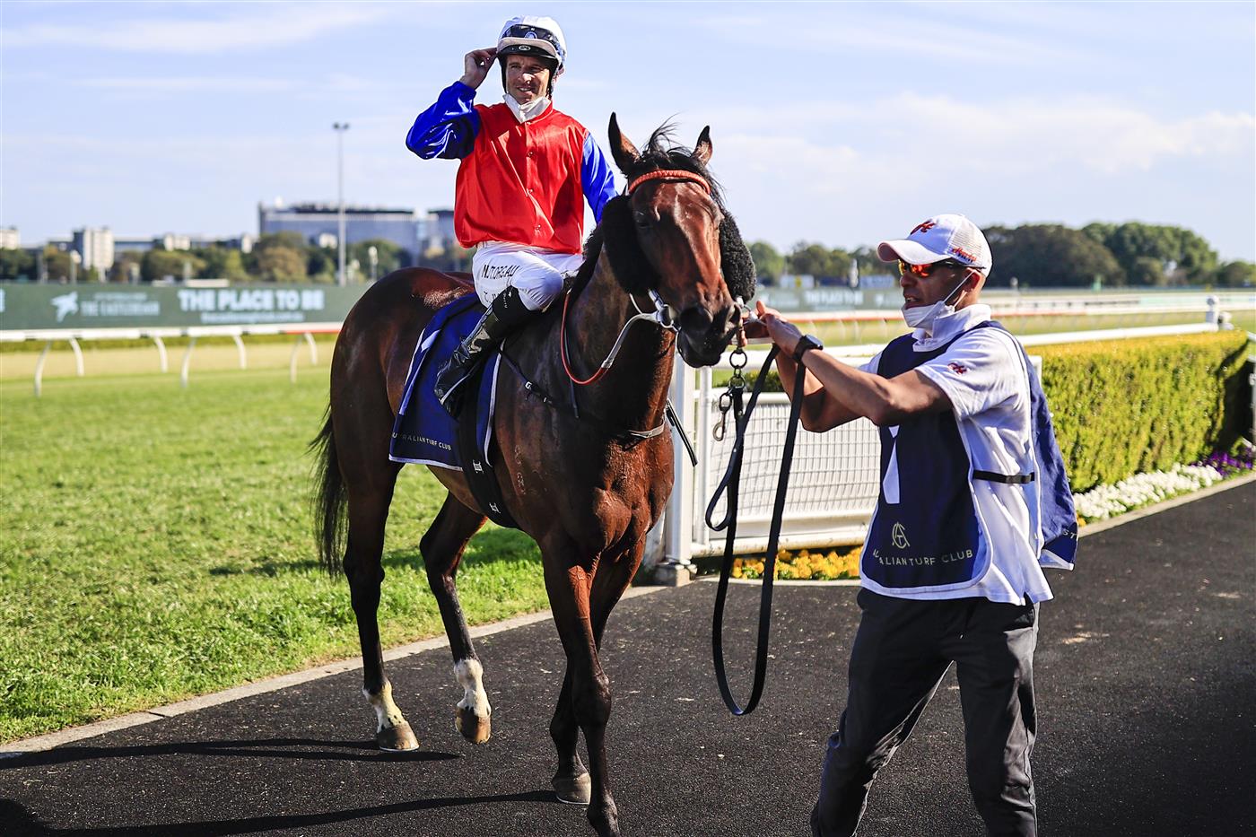SYDNEY, AUSTRALIA - OCTOBER 23: Tommy Berry on Hilal salutes as he returns to scale after winning race 8 the Bondi Stakes during Sydney Racing at Royal Randwick Racecourse on October 23, 2021 in Sydney, Australia. (Photo by Mark Evans/Getty Images)