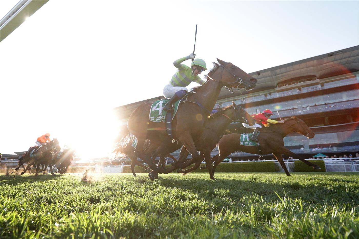 SYDNEY, AUSTRALIA - OCTOBER 23: Tommy Berry on Quantico (red) wins race 10 the Southern Cross Group Handicap during Sydney Racing at Royal Randwick Racecourse on October 23, 2021 in Sydney, Australia. (Photo by Mark Evans/Getty Images)