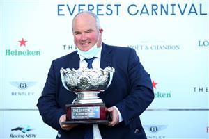 SYDNEY, AUSTRALIA - OCTOBER 23: Brad Widdup trainer of Icebath celebrates with the trophy after winning race 9 The Invitation during Sydney Racing at Royal Randwick Racecourse on October 23, 2021 in Sydney, Australia. (Photo by Jason McCawley/Getty Images for ATC)