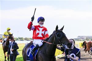 SYDNEY, AUSTRALIA - OCTOBER 23: Kerrin McEvoy on Icebath salutes after winning race 9 The Invitation during Sydney Racing at Royal Randwick Racecourse on October 23, 2021 in Sydney, Australia. (Photo by Mark Evans/Getty Images)