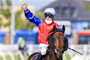 SYDNEY, AUSTRALIA - OCTOBER 23: Tommy Berry on Hilal salutes as he returns to scale after winning
 race 8 the Bondi Stakes during Sydney Racing at Royal Randwick Racecourse on October 23, 2021 in Sydney, Australia. (Photo by Mark Evans/Getty Images)