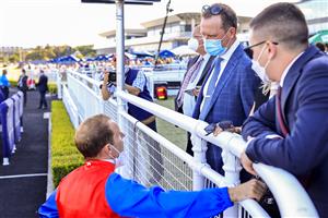 SYDNEY, AUSTRALIA - OCTOBER 23: Tommy Berry talks to trainer Michael Hawkes after winning race 8 the Bondi Stakes on Hilal during Sydney Racing at Royal Randwick Racecourse on October 23, 2021 in Sydney, Australia. (Photo by Mark Evans/Getty Images)