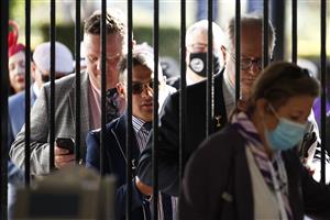 MELBOURNE, AUSTRALIA - NOVEMBER 02: Racegoers queue to enter during 2021 Melbourne Cup Day at Flemington Racecourse on November 02, 2021 in Melbourne, Australia. (Photo by Daniel Pockett/Getty Images)