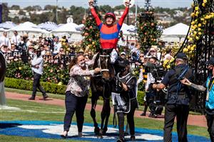 MELBOURNE, AUSTRALIA - NOVEMBER 02: James Mc Donald is seen cheering after winning race 7 during the 2021 Melbourne Cup Day at Flemington racecourse on November 02, 2021 in Melbourne, Australia. (Photo by Diego Fedele/Getty Images)